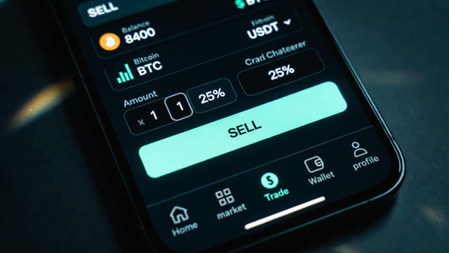 Crypto exchange interface on a phone showing USDC to fiat conversion for digital sellers